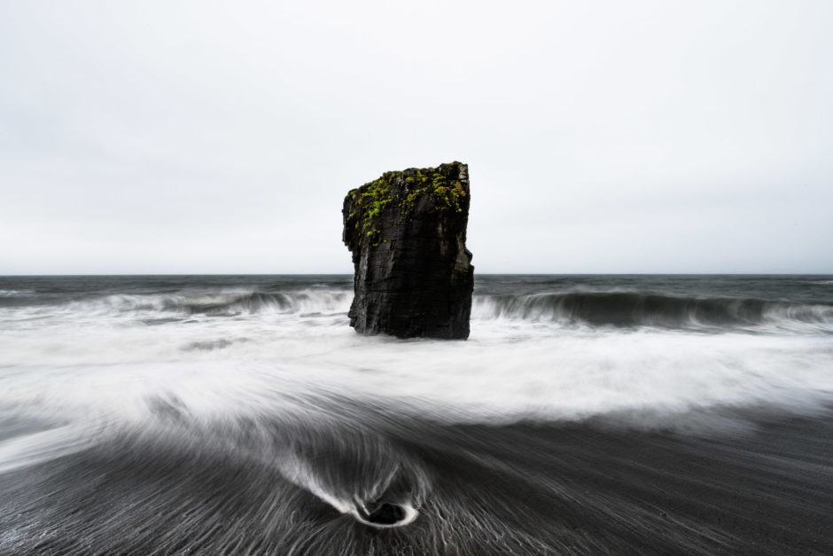 Sea stack on a black beach